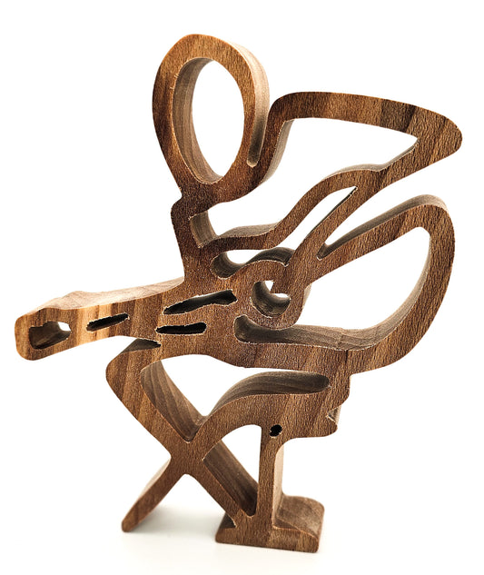 Handcrafted hardwood guitarist sculpture on a white background