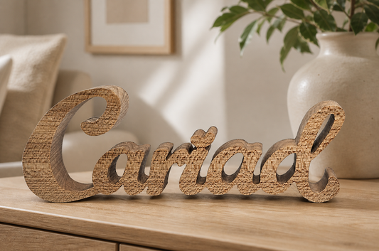 Handmade Cariad wooden word ornament in natural hardwood