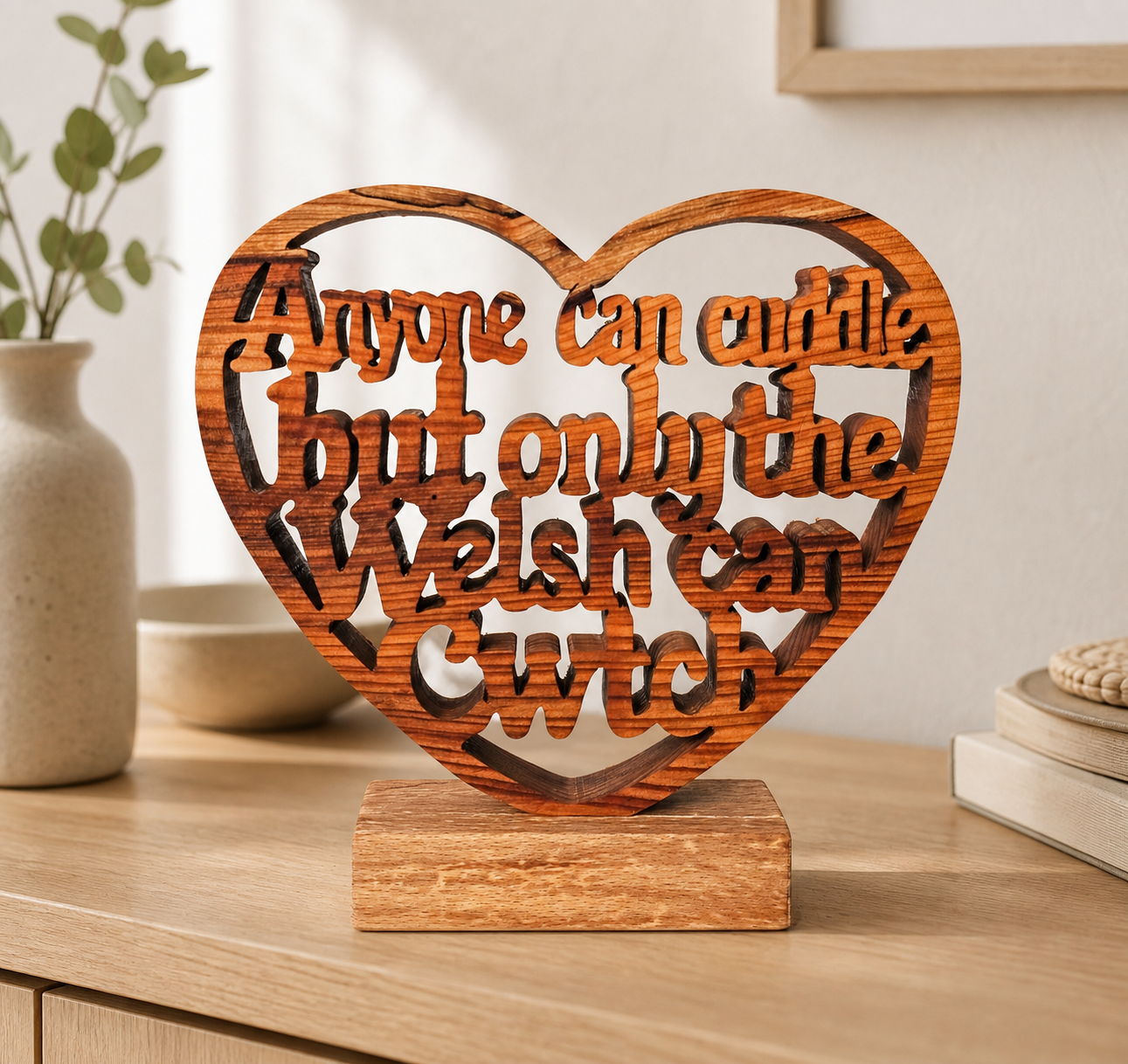 Handcrafted wooden heart ornament reading 'Anyone can cuddle but only the Welsh can cwtch'